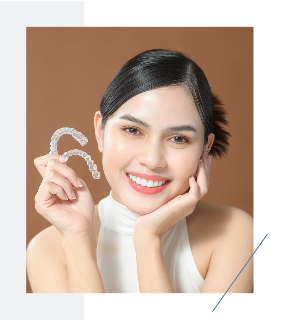 Beautiful Girl Holding Invisalign Clear Aligners In Hand