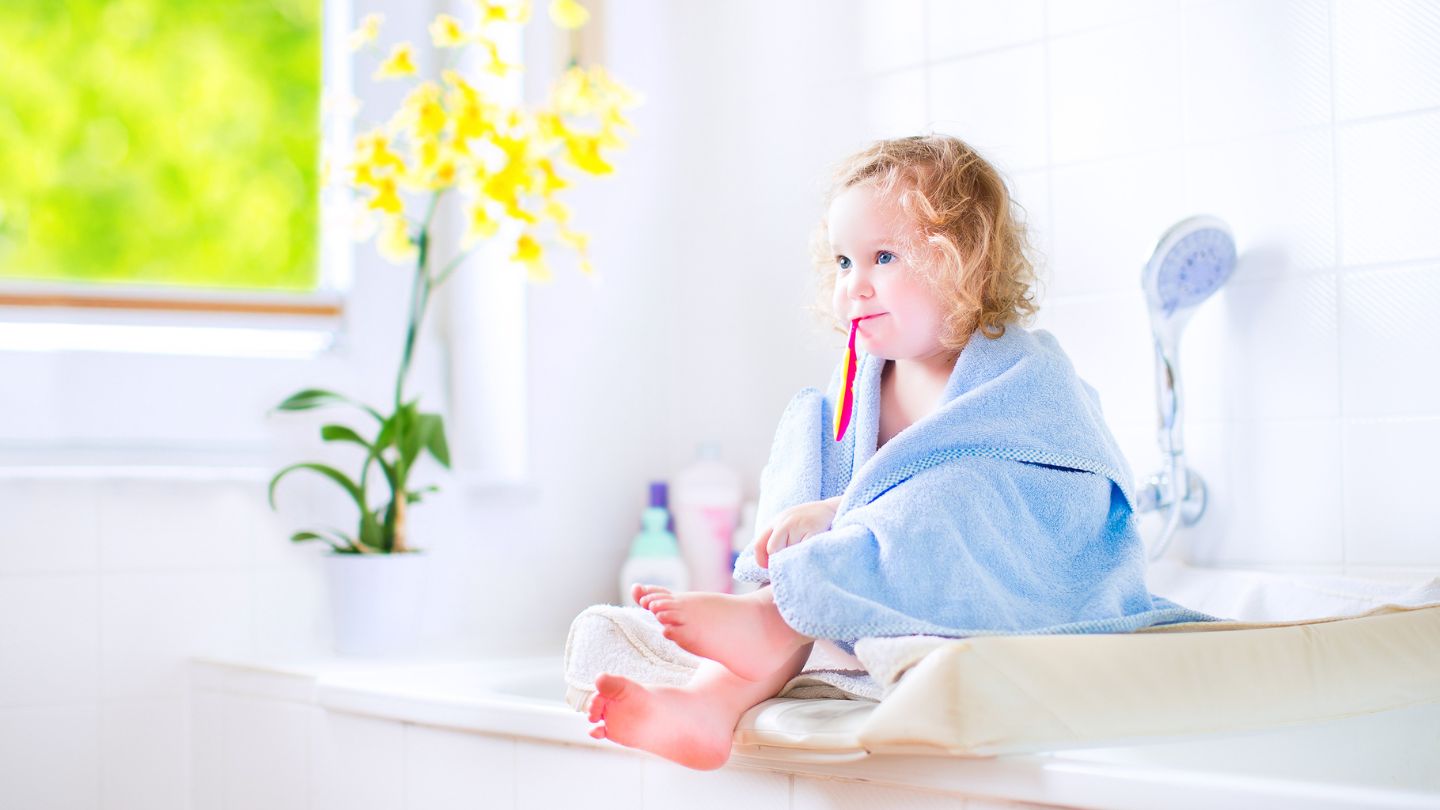 Child Brushing Her Teeth